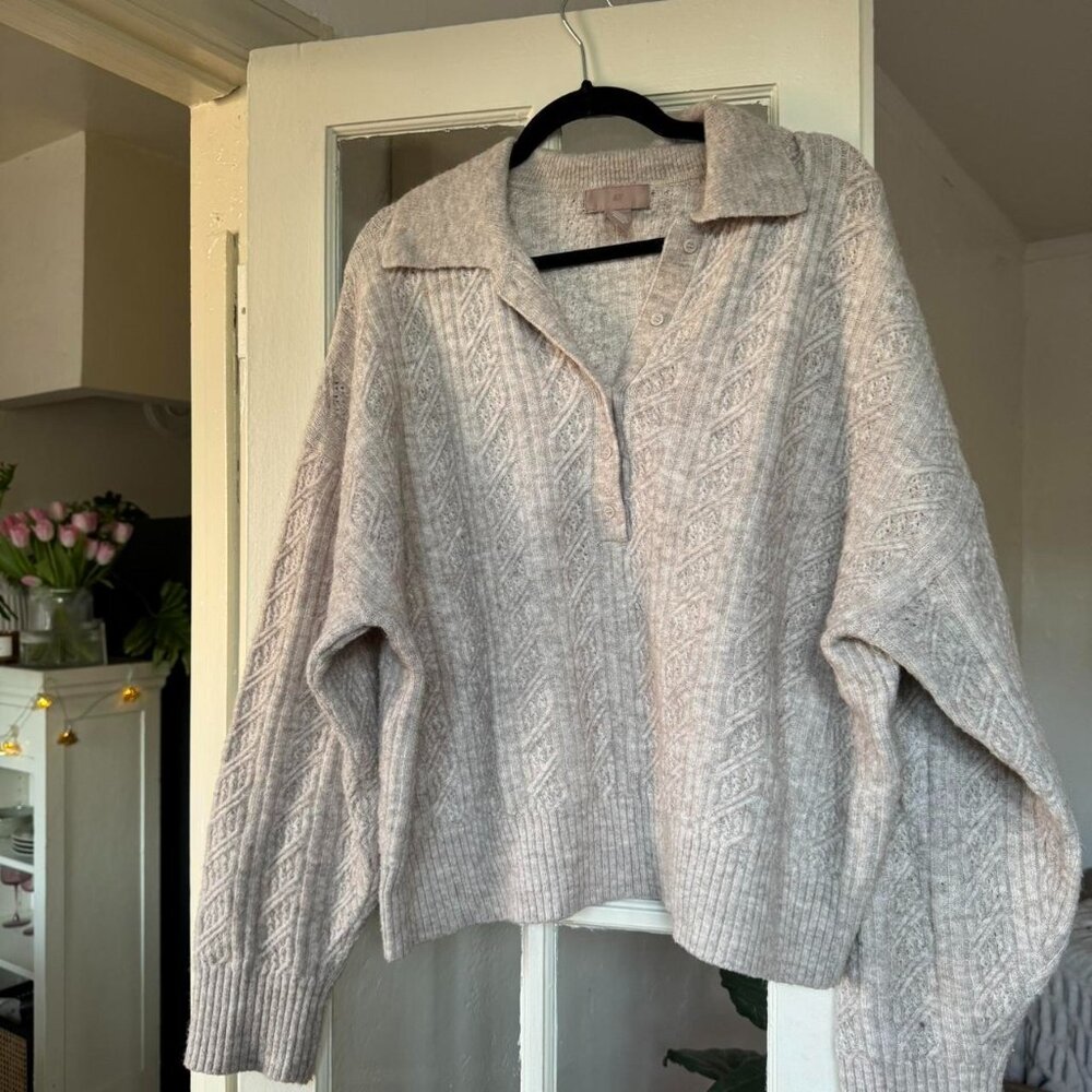 Pull over sweater with buttons.